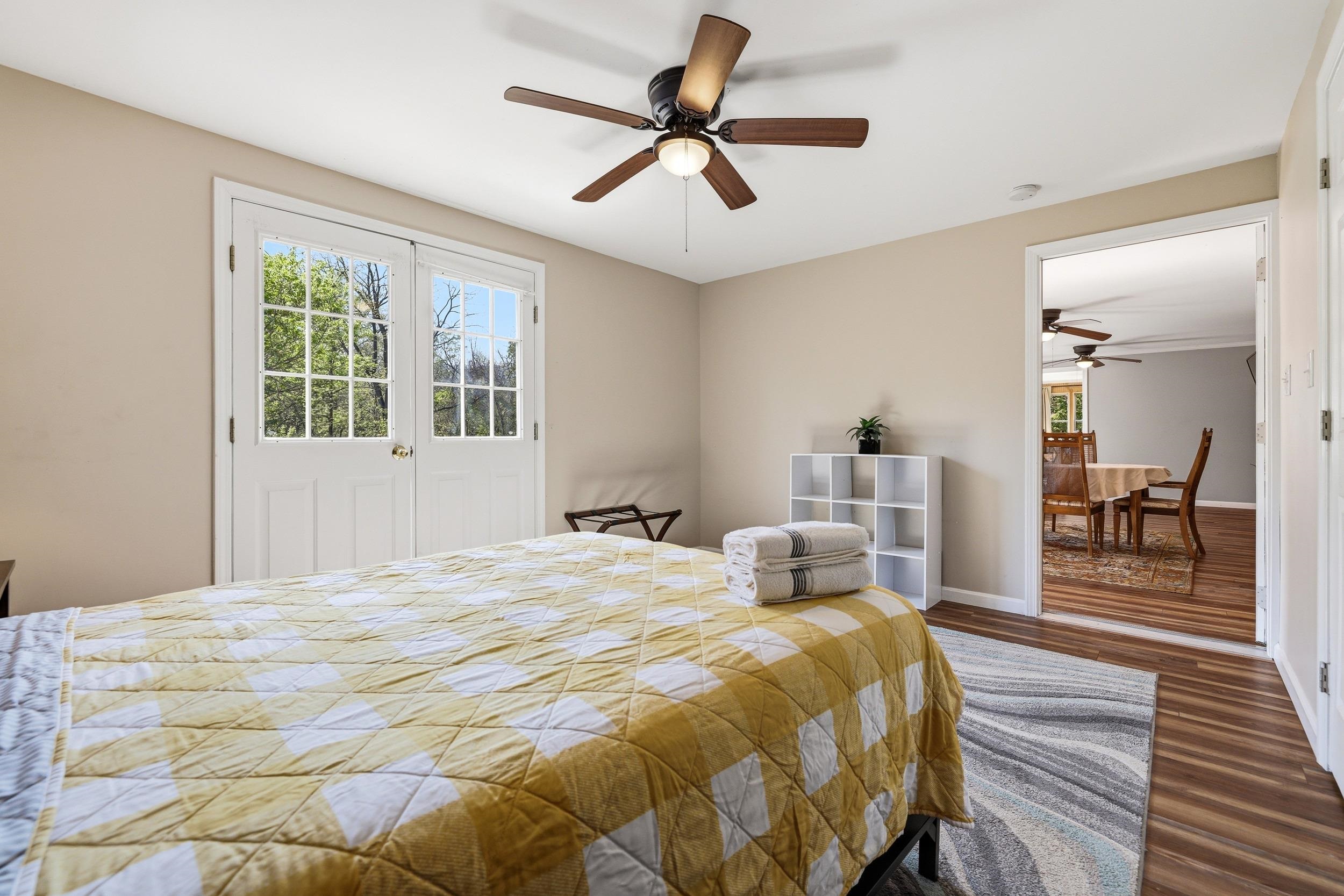 702 Richview Road Rileyville, VA 22650 - Photo 28 of 75 a bedroom with a bed and a chandelier