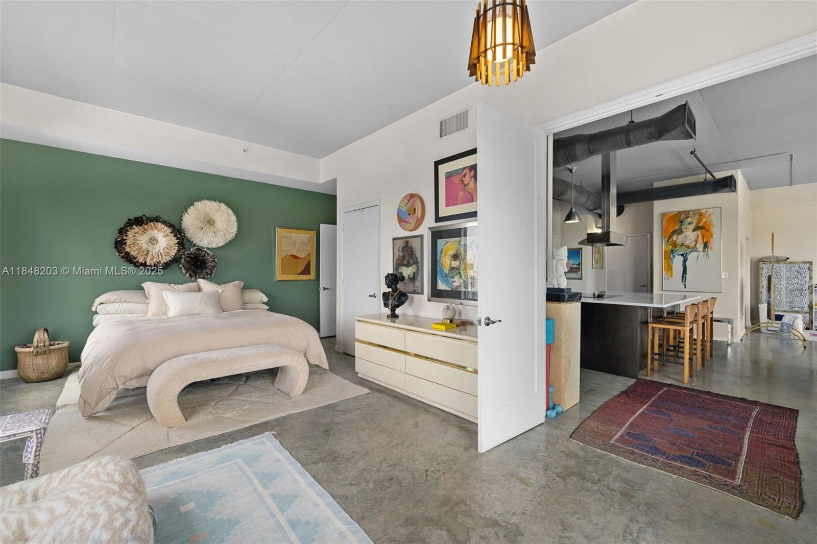 10 Southwest South River Drive, Unit 1614 Miami, FL 33130 - Photo 12 of 21 a bedroom with a bed and a chandelier