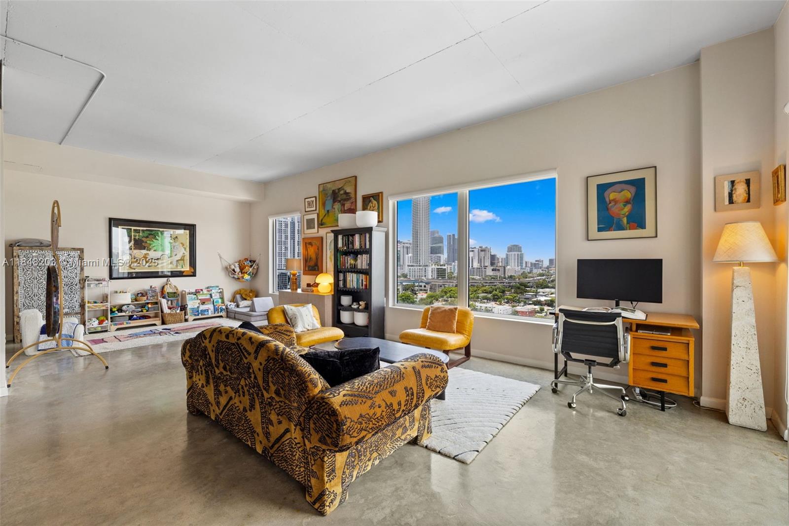 10 Southwest South River Drive, Unit 1614 Miami, FL 33130 - Photo 4 of 21 a living room with furniture and a flat screen tv
