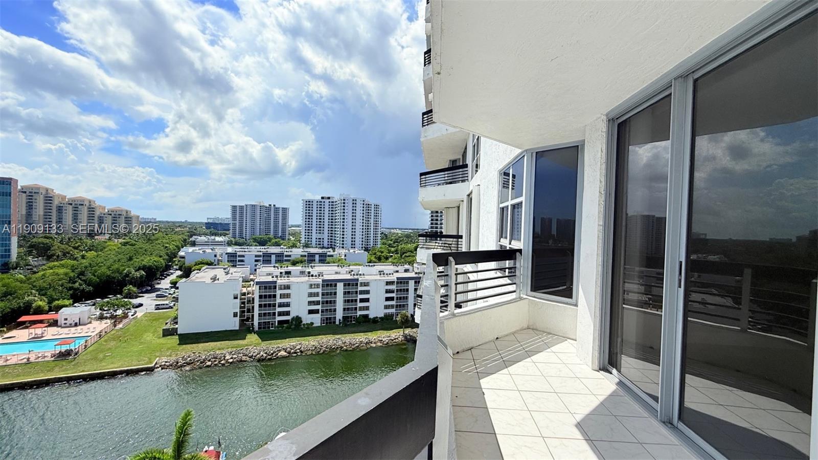 3530 Mystic Pointe Drive, Unit 1204 Aventura, FL 33180 - Photo 3 of 16 a balcony with outdoor seating and city view