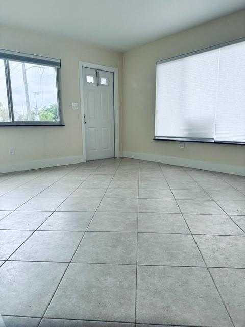 1800 Northeast 4th Street Pompano Beach, FL 33060 - Photo 4 of 8 a view of a livingroom with wooden floor and a window