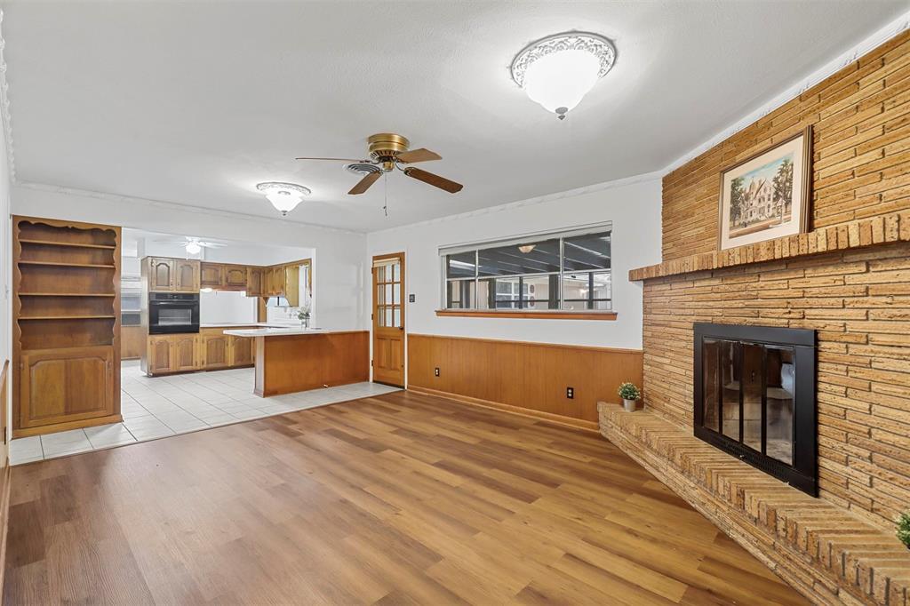 a view of a living room a window and a fireplace