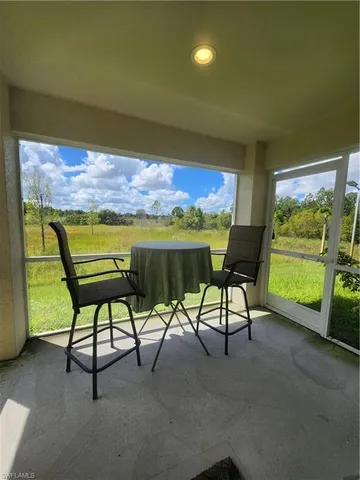 a view of an chairs and tables in the room