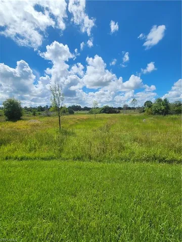 a view of an ocean beach and city