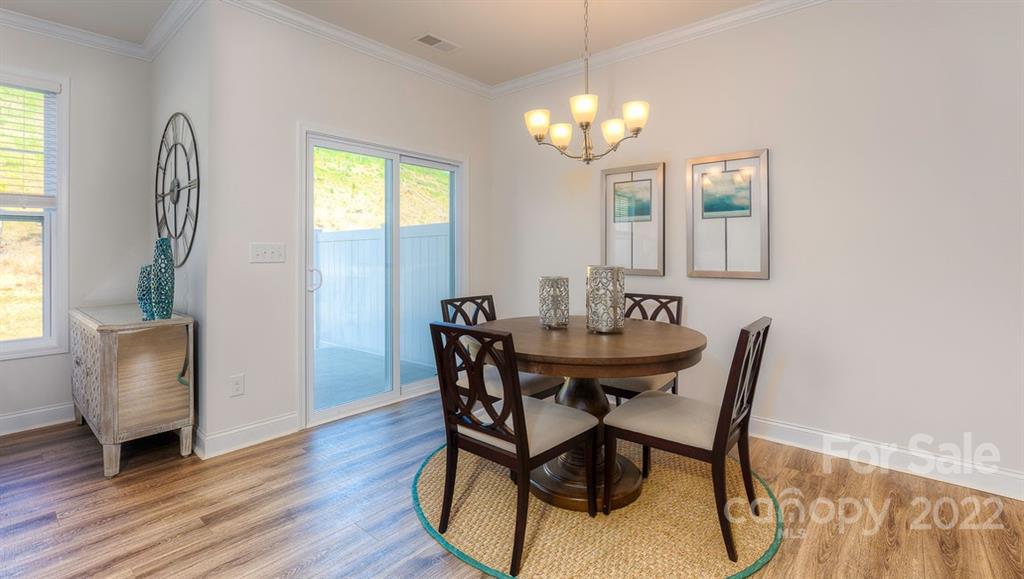 131 Creekview Road Hendersonville, NC 28792 - Photo 11 of 30 a view of a dining room with furniture and window