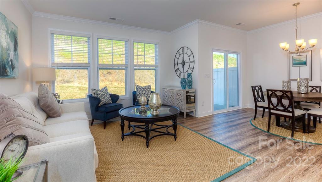 131 Creekview Road Hendersonville, NC 28792 - Photo 13 of 30 a living room with furniture and a large window