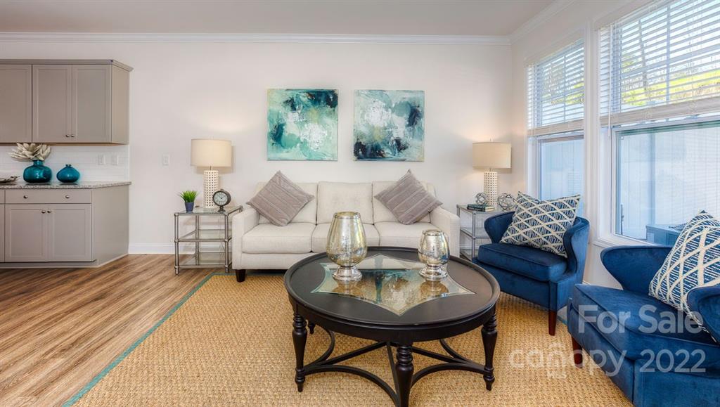 131 Creekview Road Hendersonville, NC 28792 - Photo 14 of 30 a living room with furniture and a table