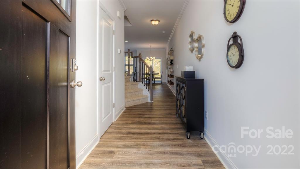 131 Creekview Road Hendersonville, NC 28792 - Photo 2 of 30 a view of a hallway with wooden floor and entryway