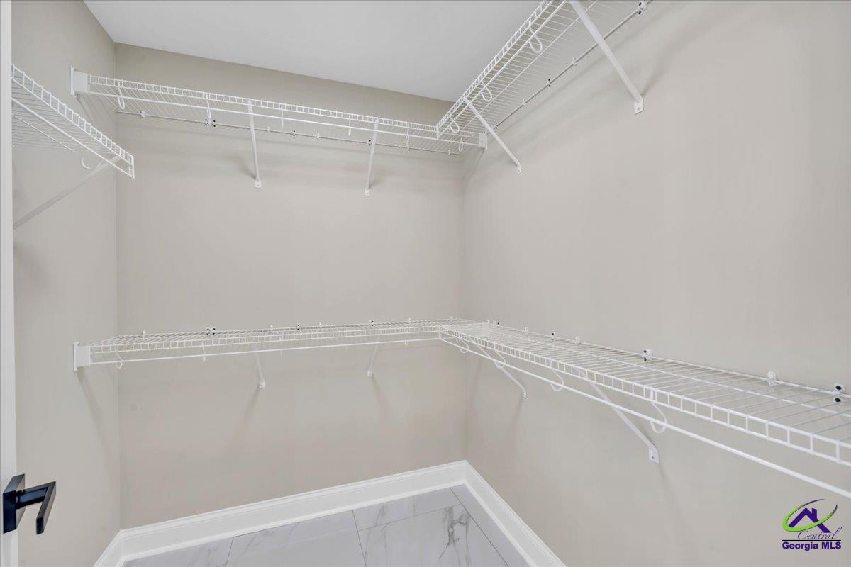 103 Early Drive Byron, GA 31008 - Photo 34 of 56 a view of a room with racks on the wall