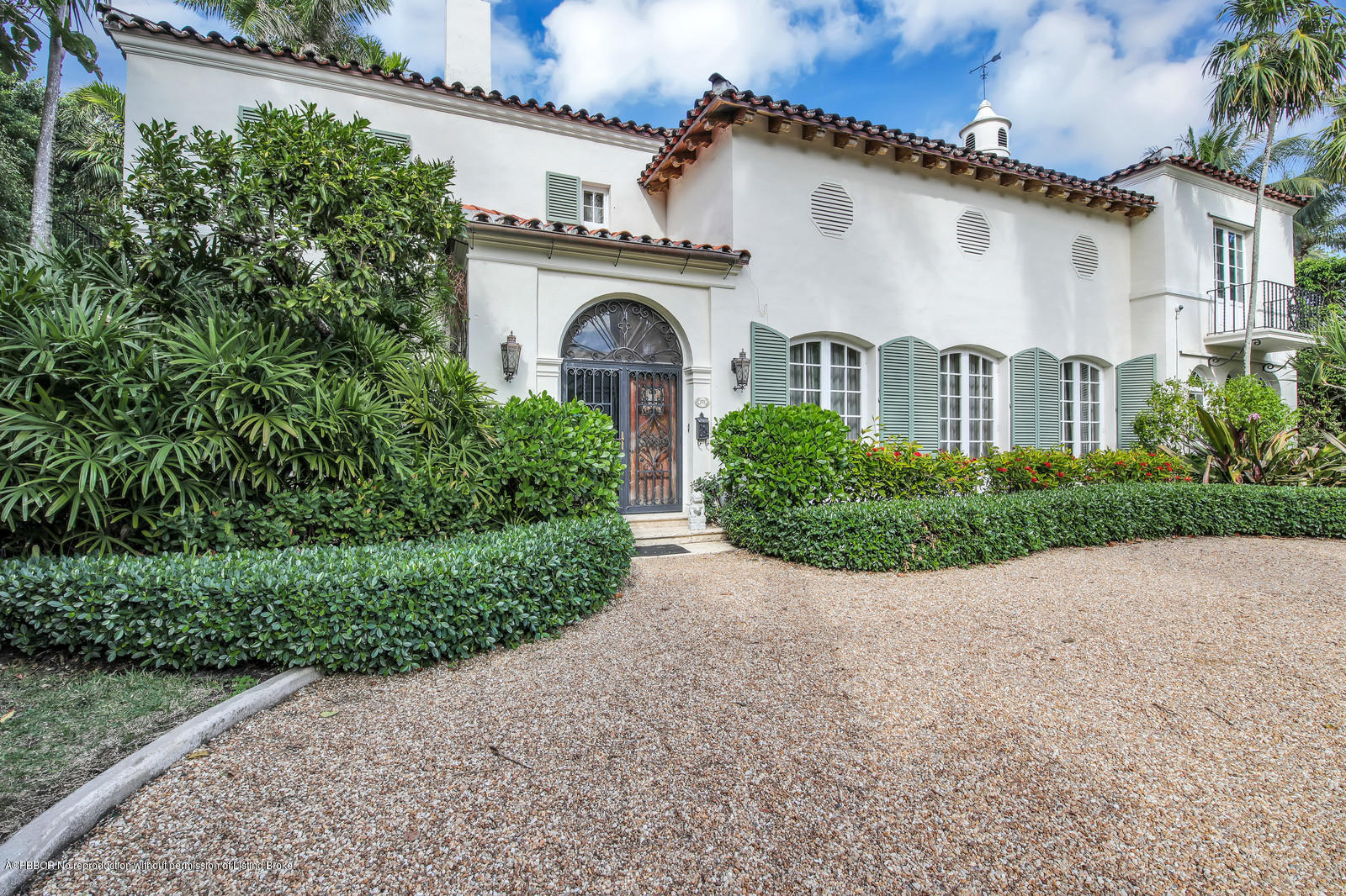 271 El Vedado Road Palm Beach, FL 33480 - Photo 2 of 32 a front view of a house with garden