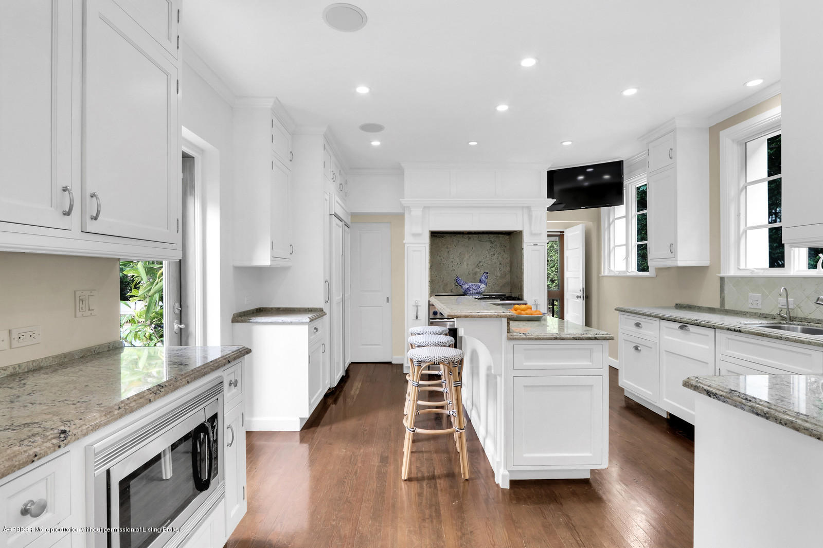271 El Vedado Road Palm Beach, FL 33480 - Photo 12 of 32 a kitchen with white cabinets and stainless steel appliances