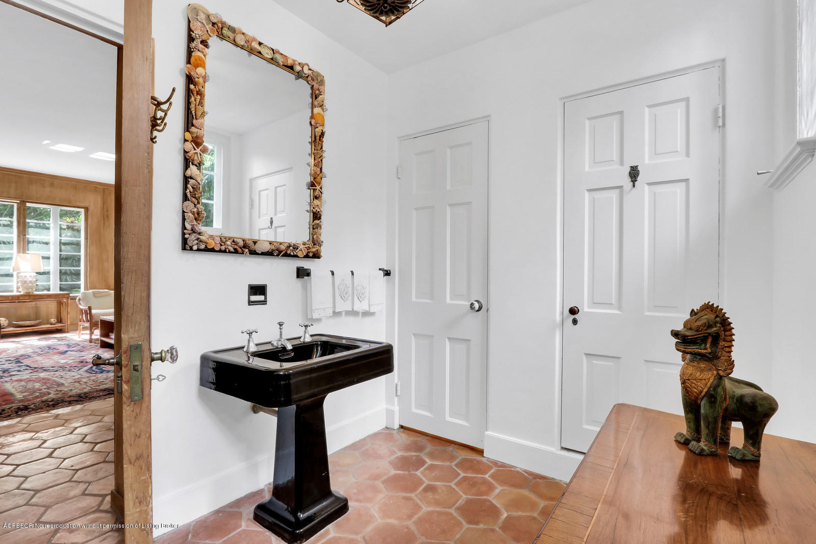 271 El Vedado Road Palm Beach, FL 33480 - Photo 15 of 32 a bathroom with a sink and a mirror