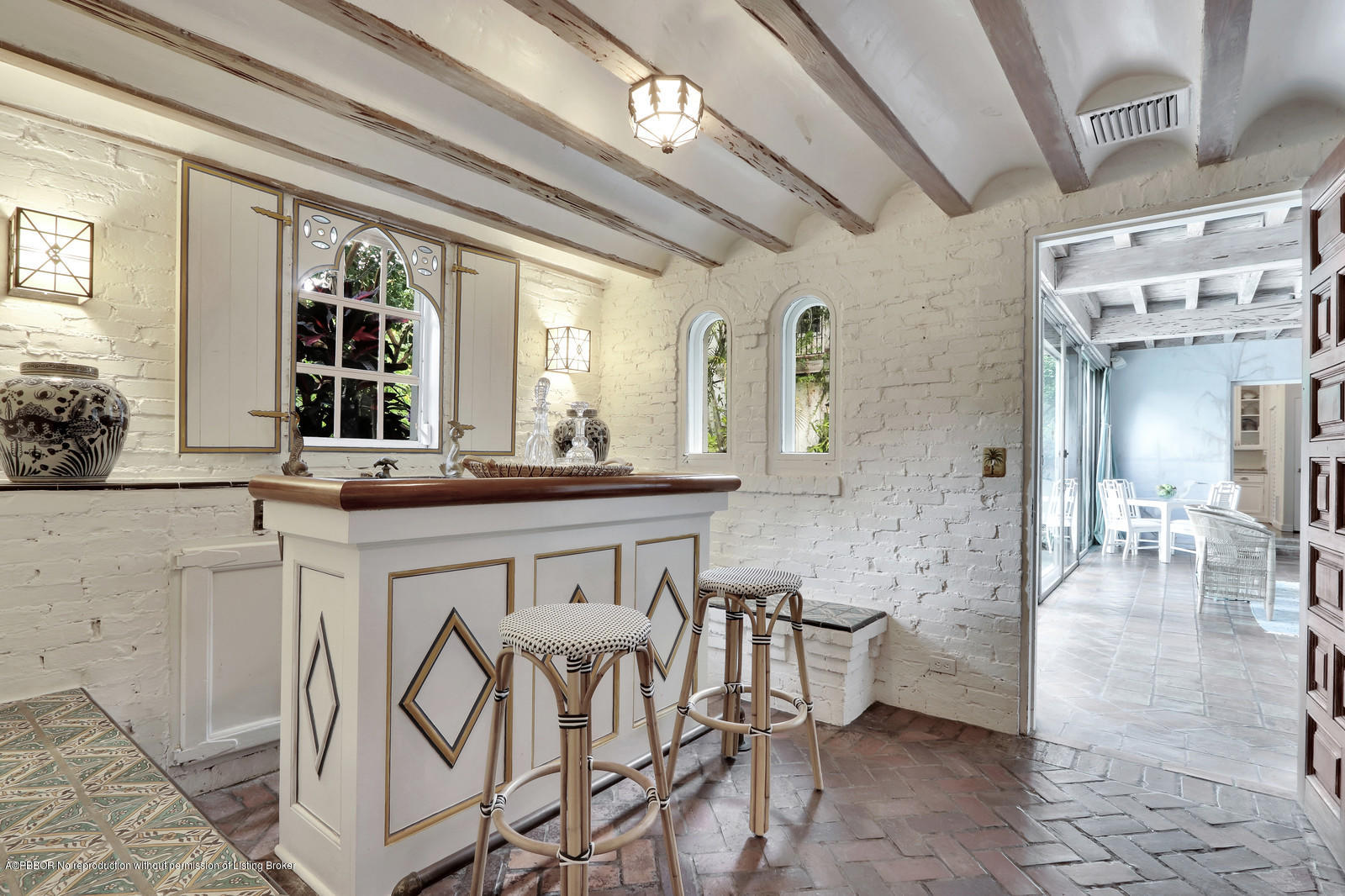 271 El Vedado Road Palm Beach, FL 33480 - Photo 16 of 32 a dining hall with stainless steel appliances kitchen island granite countertop a table chairs and a view of living room