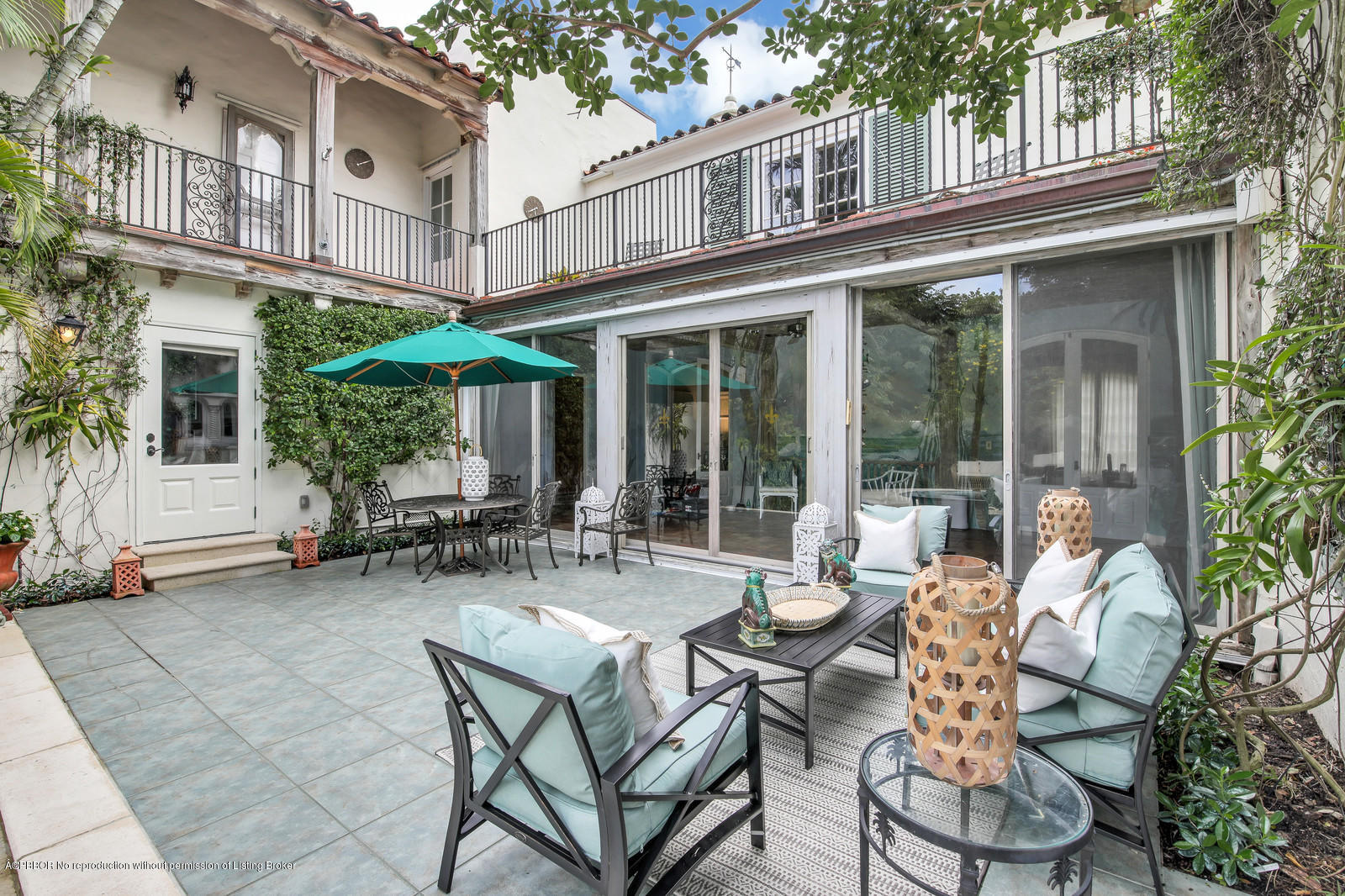 271 El Vedado Road Palm Beach, FL 33480 - Photo 28 of 32 a view of a patio with couple of chairs and tables in the patio