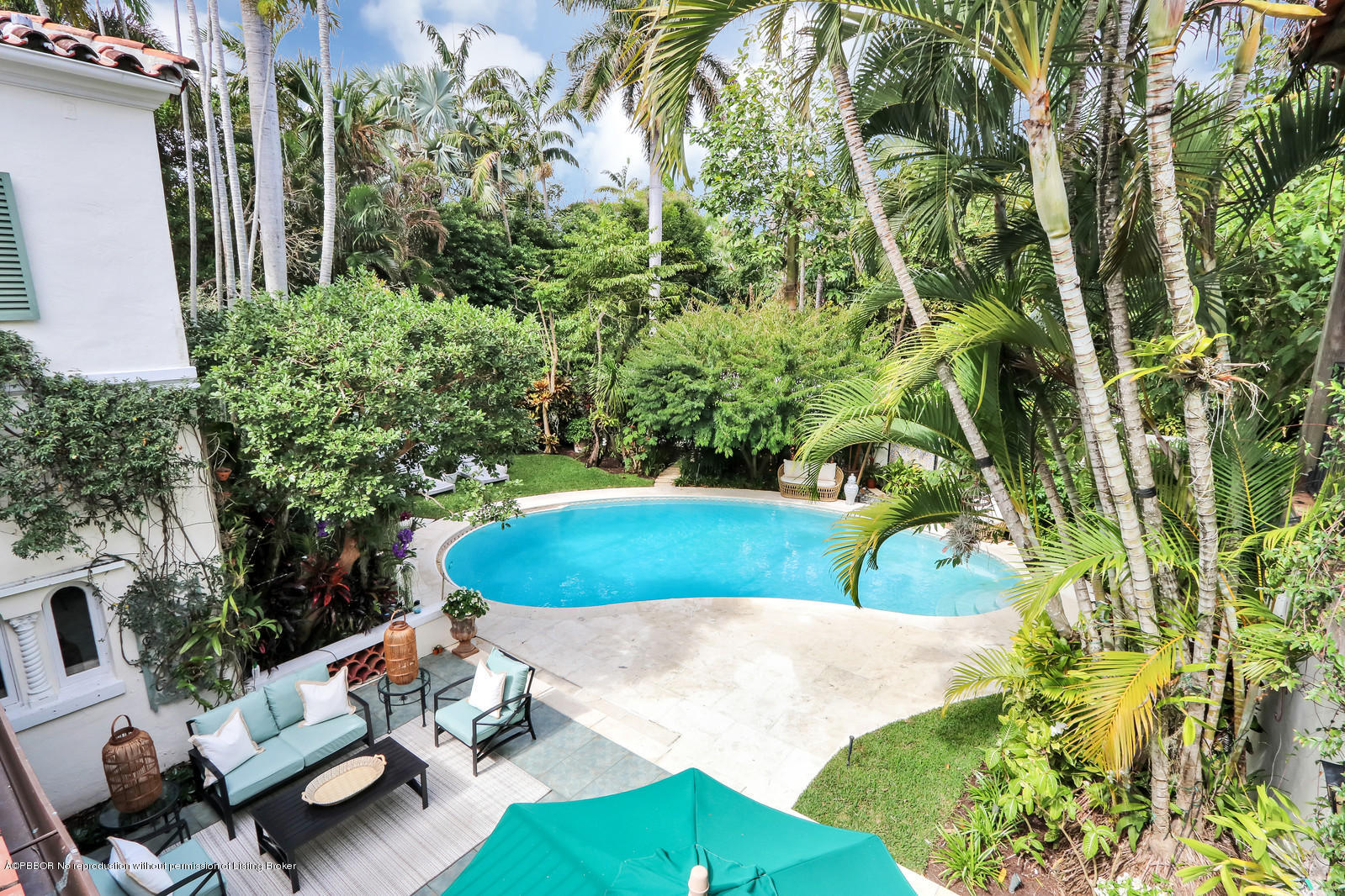 271 El Vedado Road Palm Beach, FL 33480 - Photo 32 of 32 a view of a chair and table in backyard
