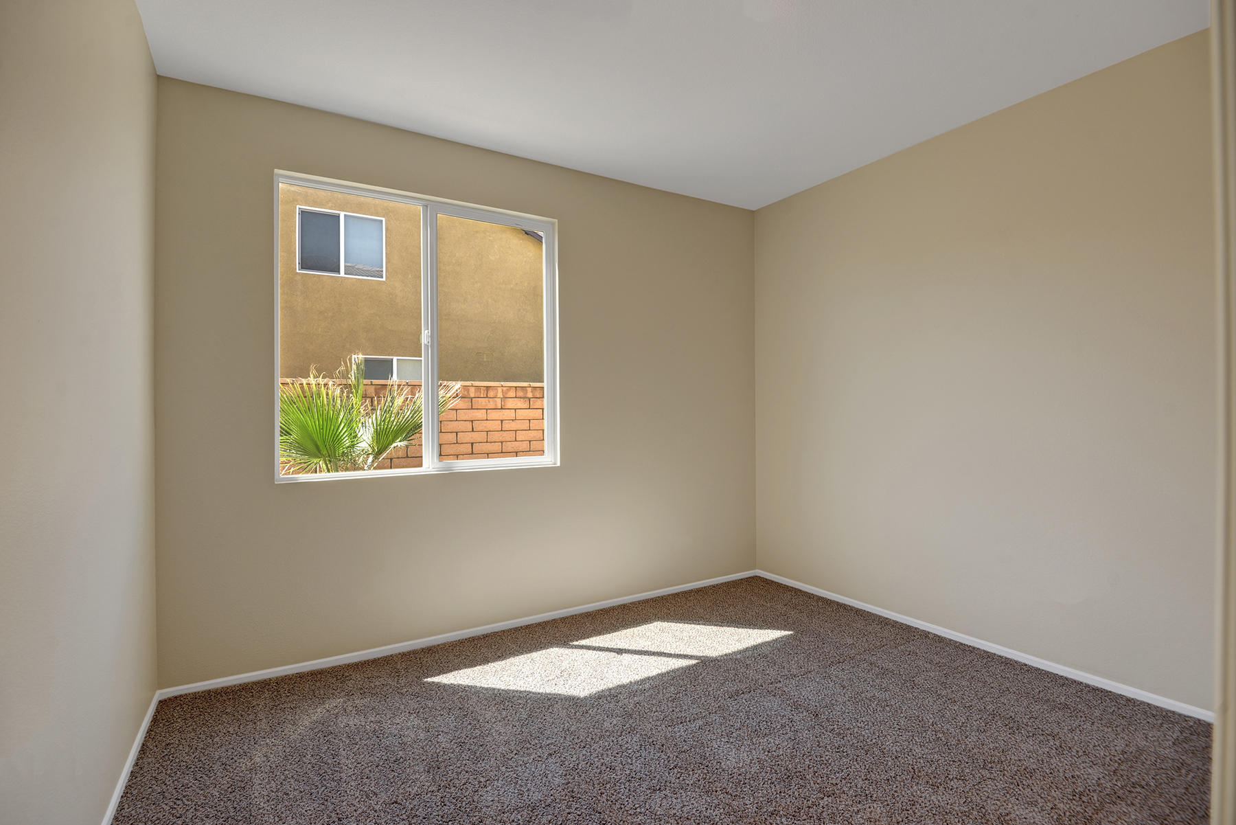 37348 Blackburn Road Indio, CA 92203 - Photo 13 of 30 an empty room with windows