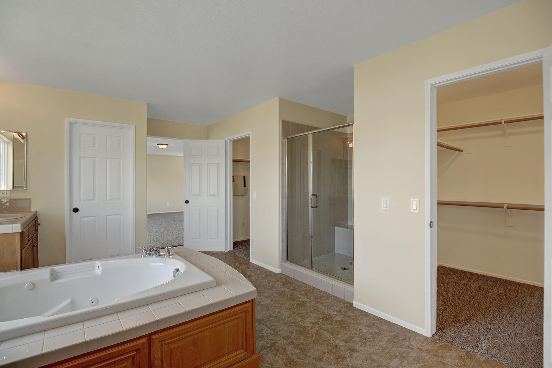 37348 Blackburn Road Indio, CA 92203 - Photo 21 of 30 a spacious bathroom with a granite countertop sink and a mirror