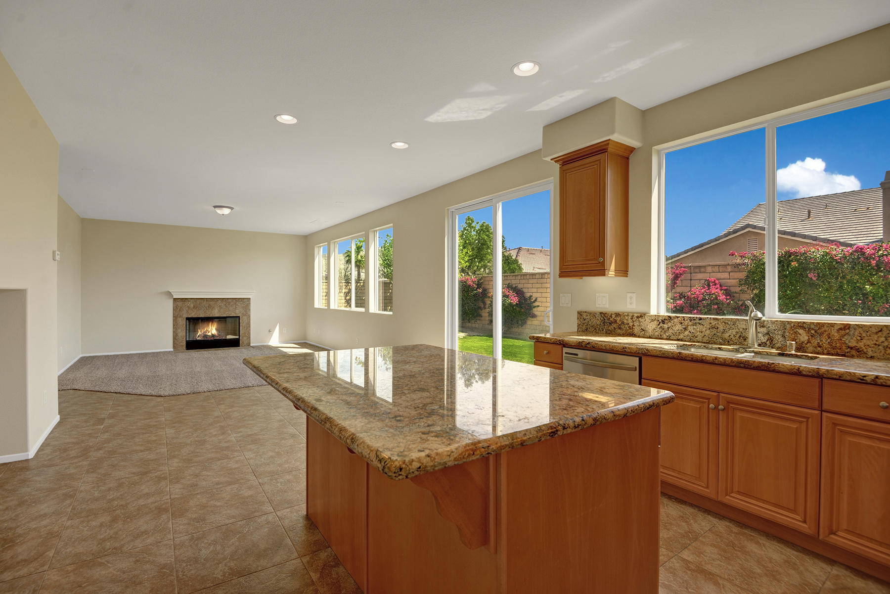 37348 Blackburn Road Indio, CA 92203 - Photo 10 of 30 a kitchen with granite countertop sink and microwave