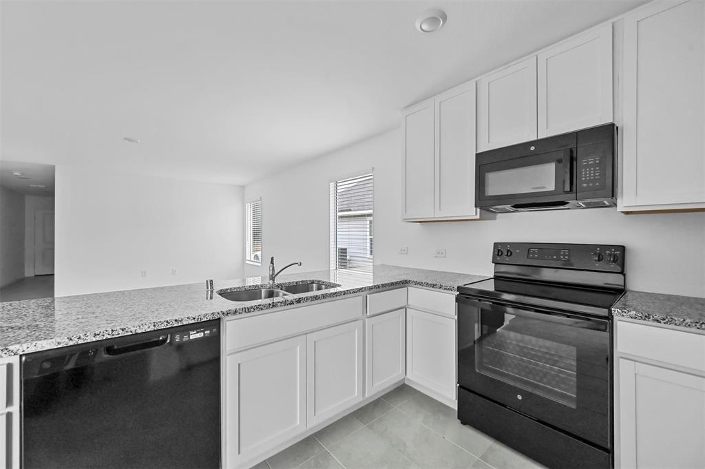 1737 Overall Lane Dallas, TX 75253 - Photo 11 of 21 a kitchen with granite countertop a sink stainless steel appliances and cabinets