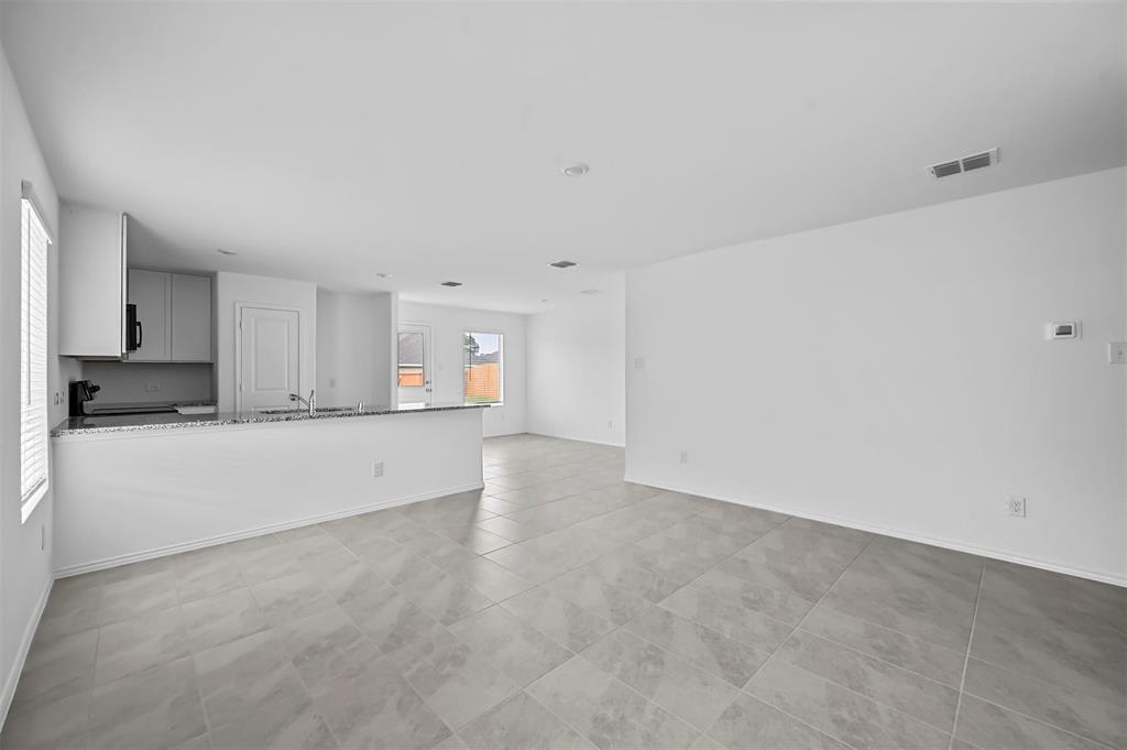 1737 Overall Lane Dallas, TX 75253 - Photo 14 of 21 a view of an empty room with kitchen