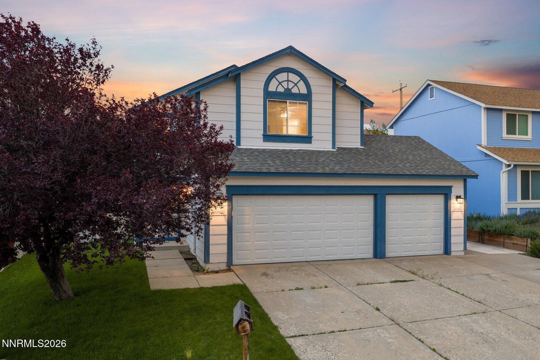 8486 Piper Place Reno, NV 89506 - Photo 55 of 80 a front view of a house with garden