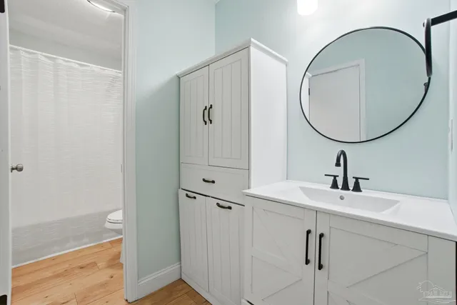 a bathroom with a sink and a mirror