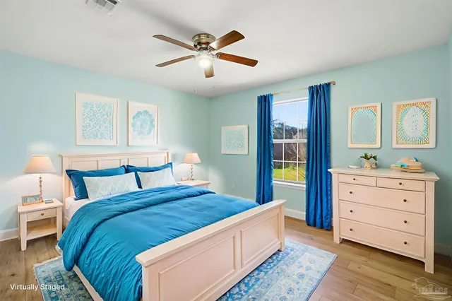 a bed room with a bed and a dresser