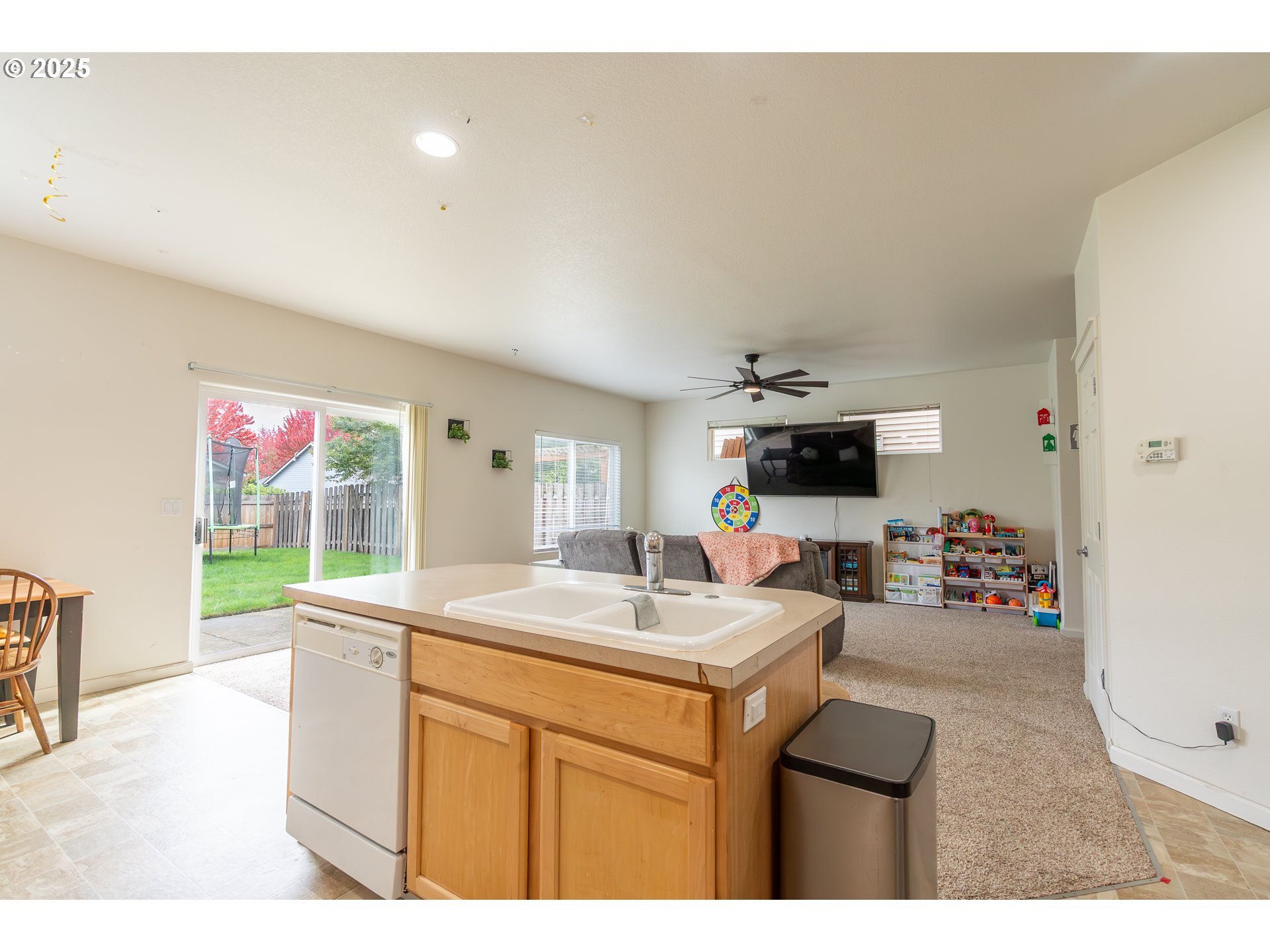 621 Jasmine Circle Independence, OR 97351 - Photo 12 of 29 a kitchen with a sink and a stove with wooden floor