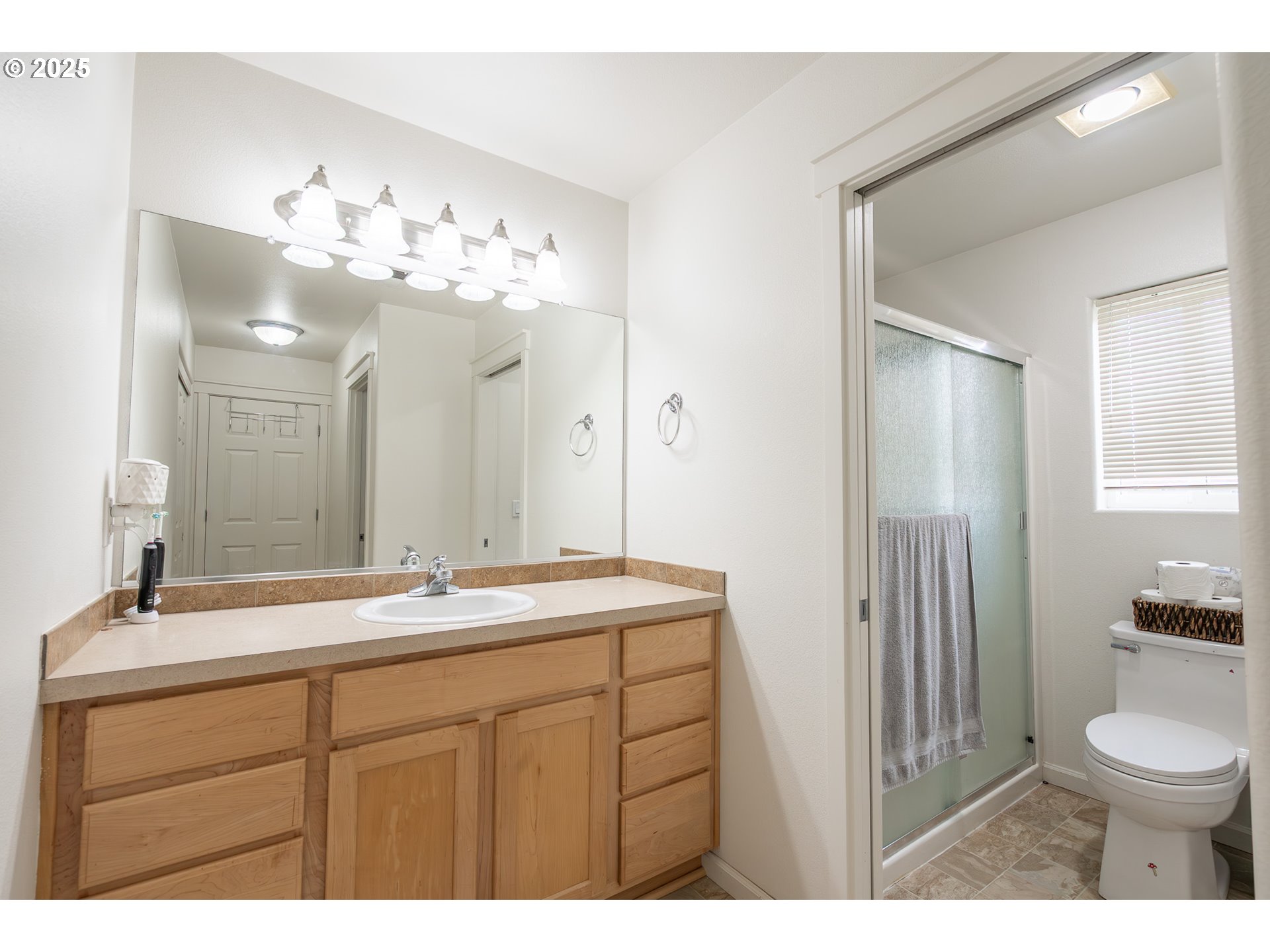 621 Jasmine Circle Independence, OR 97351 - Photo 18 of 29 a bathroom with a sink vanity mirror and toilet
