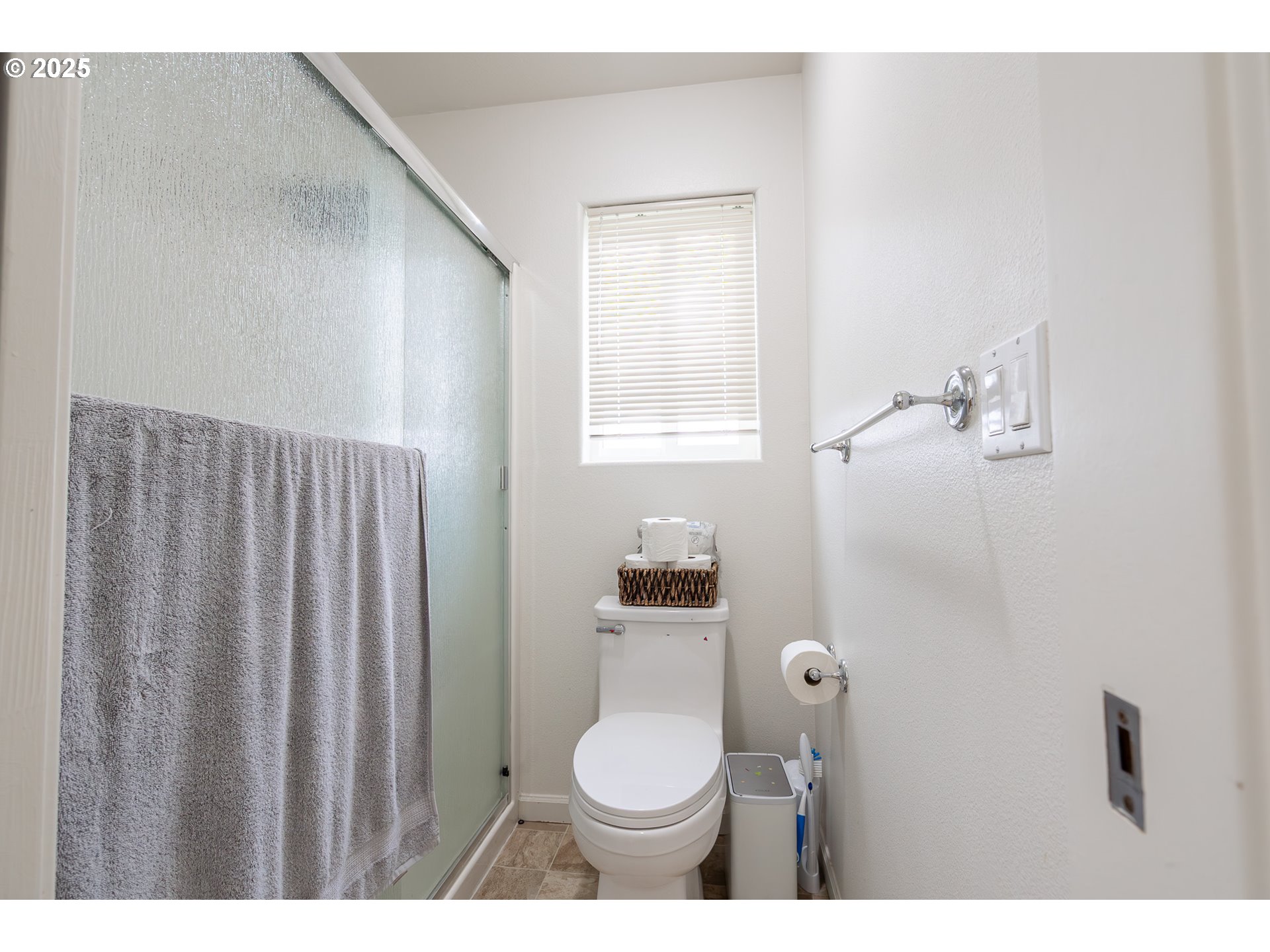 621 Jasmine Circle Independence, OR 97351 - Photo 19 of 29 a bathroom with a toilet a sink and mirror