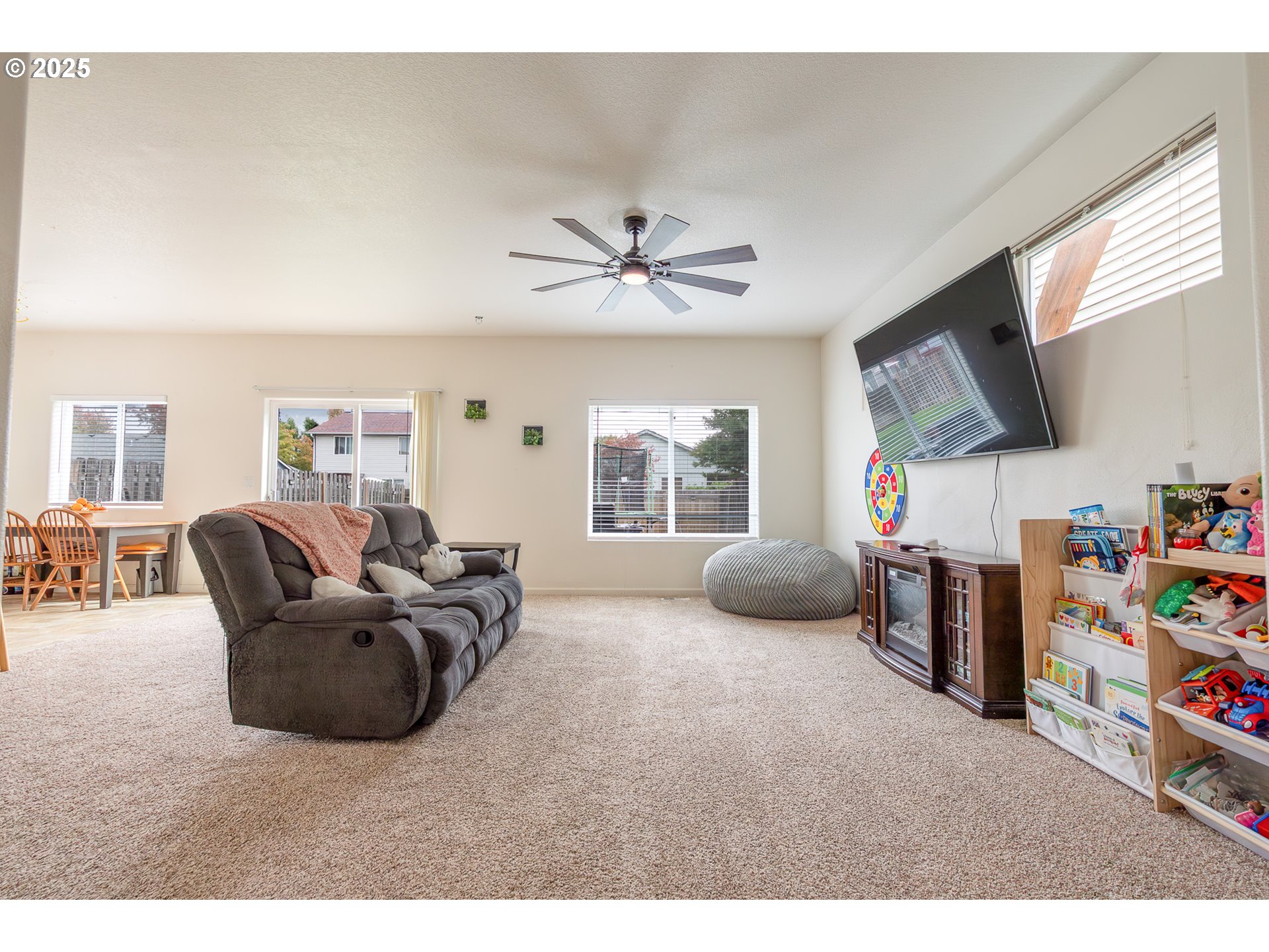 621 Jasmine Circle Independence, OR 97351 - Photo 6 of 29 a living room with furniture and a flat screen tv