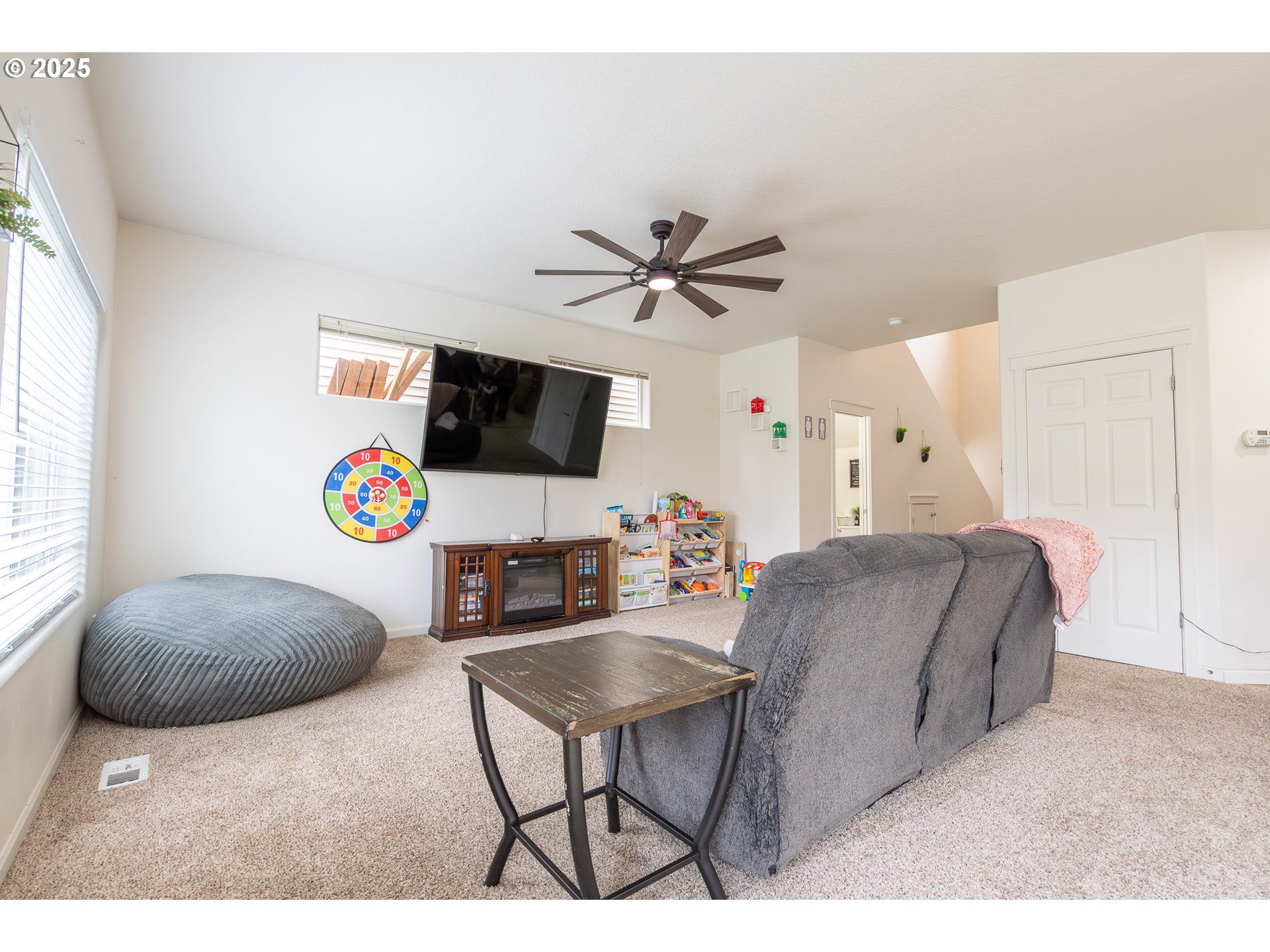 621 Jasmine Circle Independence, OR 97351 - Photo 7 of 29 a living room with furniture and a flat screen tv