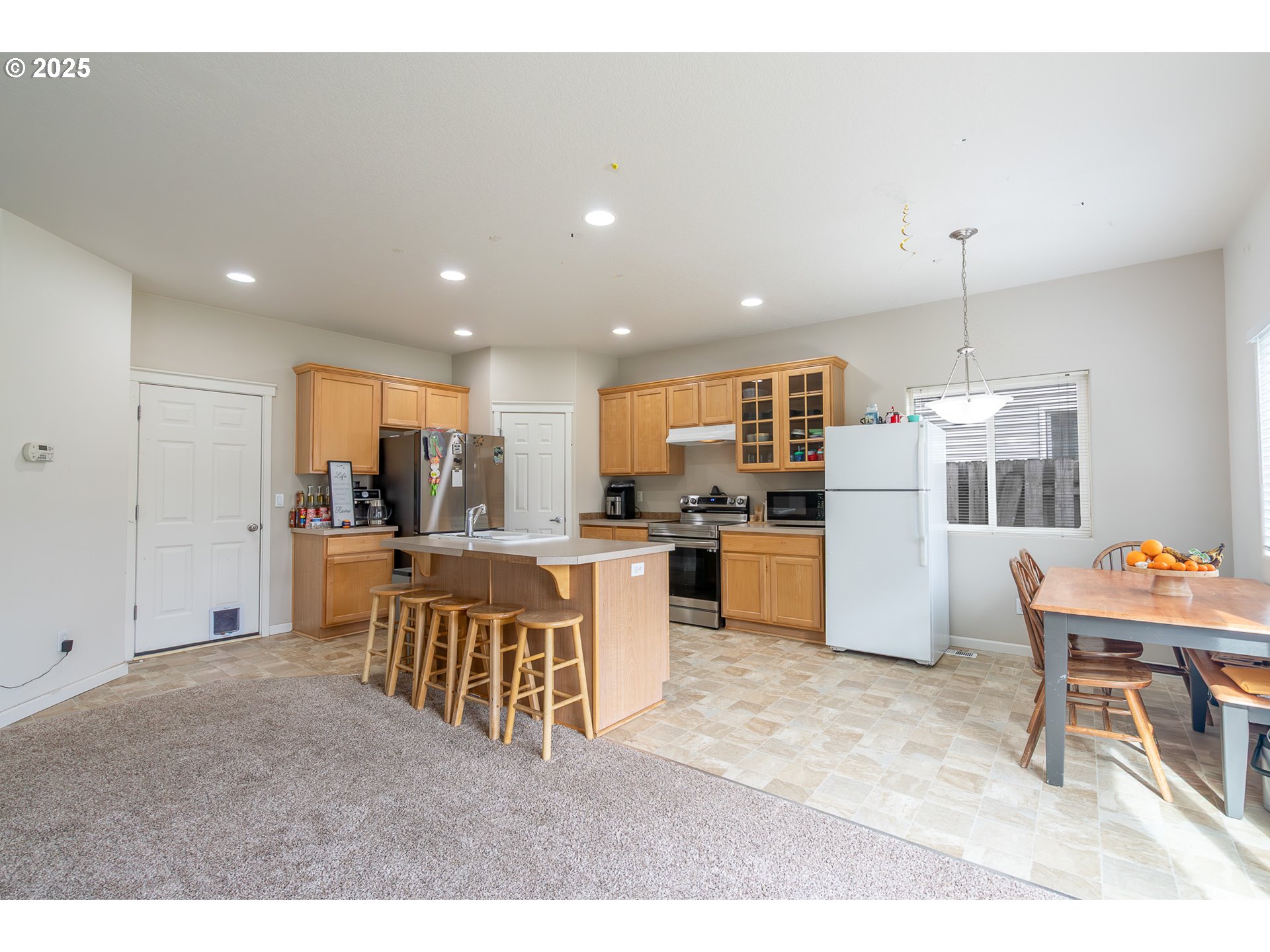 621 Jasmine Circle Independence, OR 97351 - Photo 8 of 29 a living room with stainless steel appliances kitchen island granite countertop furniture and a kitchen view