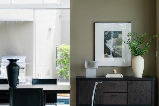 a living room with furniture and flowers