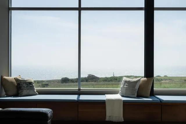 a view of a dining room with furniture window and outside view