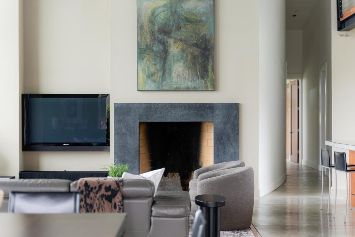 801 Bean Hollow Road Pescadero, CA 94060 - Photo 28 of 70 a living room with furniture a flat screen tv and a fireplace