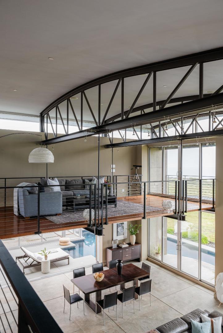 801 Bean Hollow Road Pescadero, CA 94060 - Photo 35 of 70 a living room with lots of furniture and a floor to ceiling window
