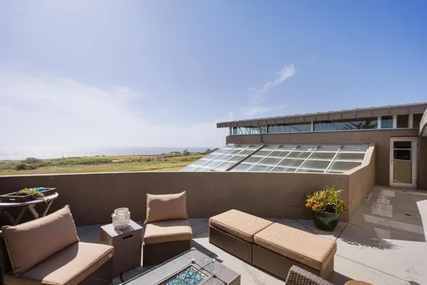 a view of a terrace with a garden
