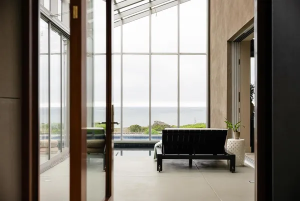 a view of a lobby area with furniture and floor to ceiling window