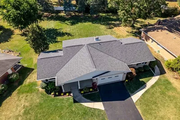 an aerial view of residential houses with outdoor space