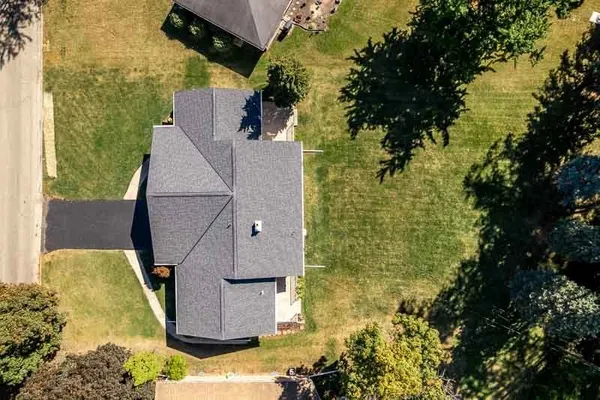 a aerial view of a house with a yard