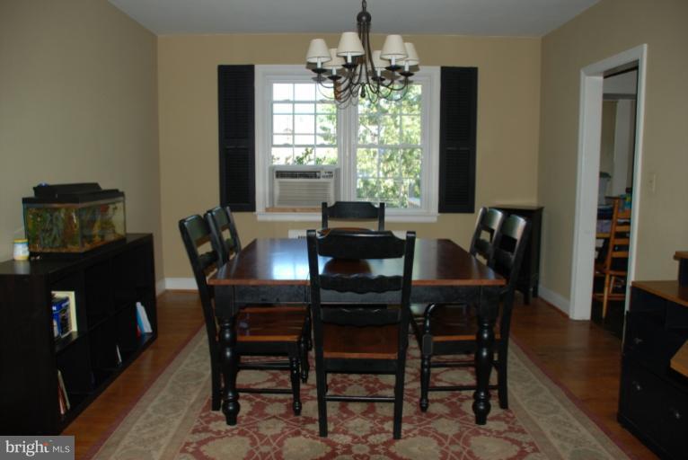 3711 Delverne Road Baltimore, MD 21218 - Photo 17 of 20 a dining room with furniture and window