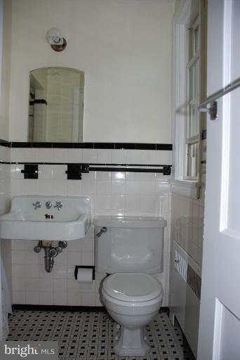 3711 Delverne Road Baltimore, MD 21218 - Photo 18 of 20 a bathroom with a toilet and a sink