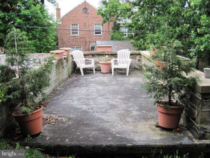 3711 Delverne Road Baltimore, MD 21218 - Photo 6 of 20 a view of a patio with chairs and potted plants
