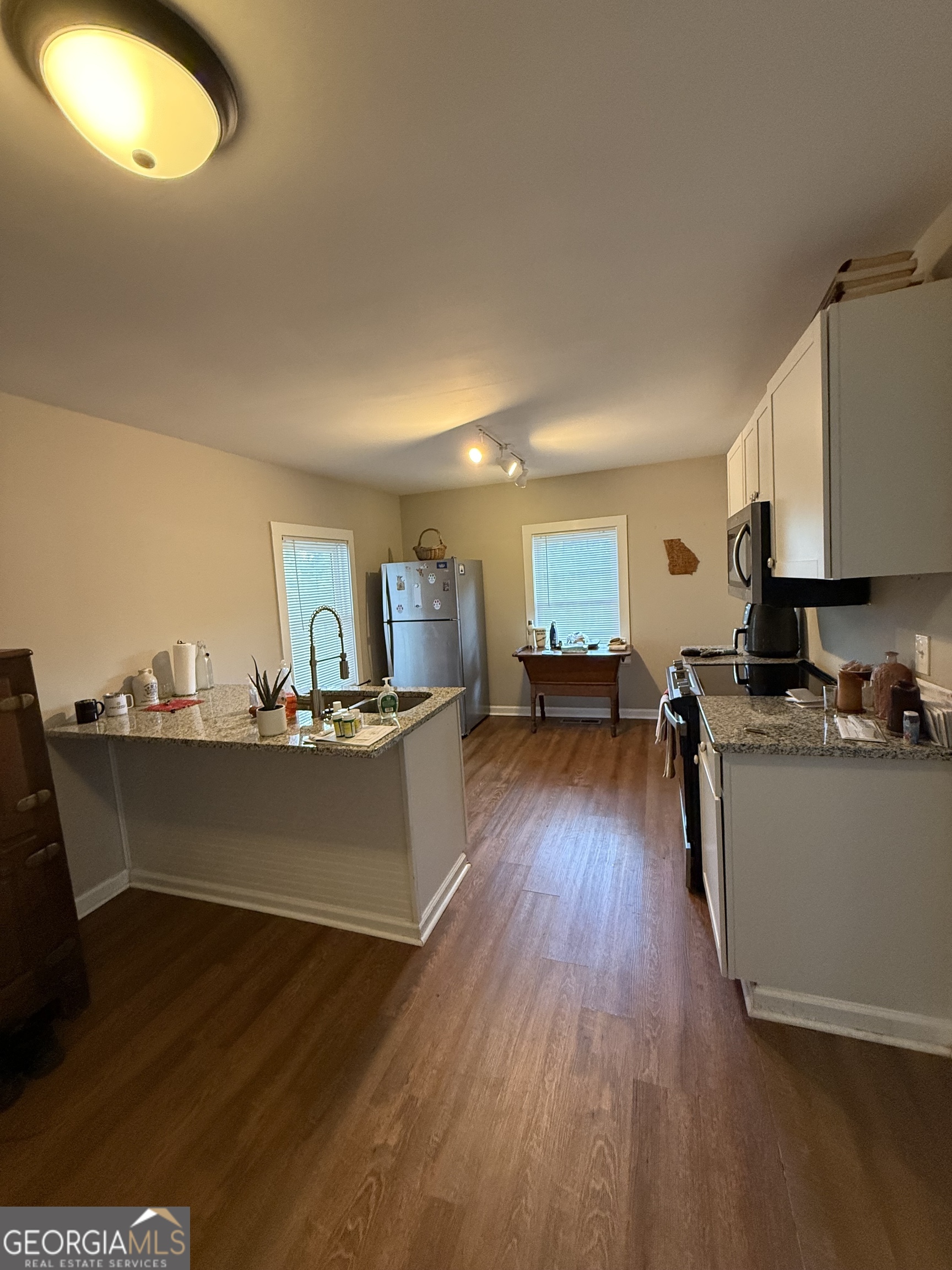 19 Carolina Street Gainesville, GA 30501 - Photo 3 of 6 a living room with furniture and a wooden floor