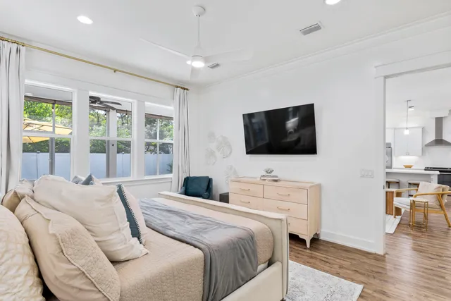 a bedroom with a bed and a flat screen tv