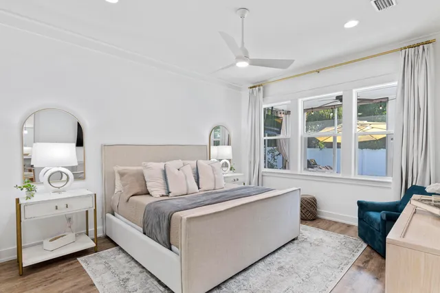 a bedroom with a large bed and a window