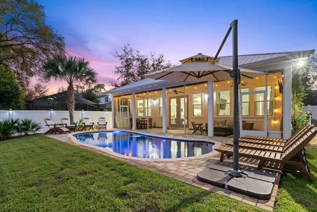 a view of a chair and tables in the patio