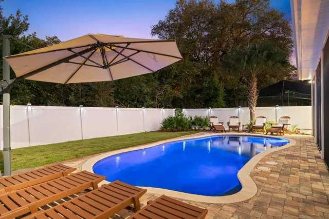 a view of a swimming pool with a patio