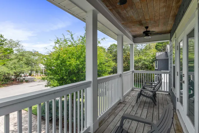 a view of a wooden deck with a yard